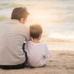 father and son on the beach